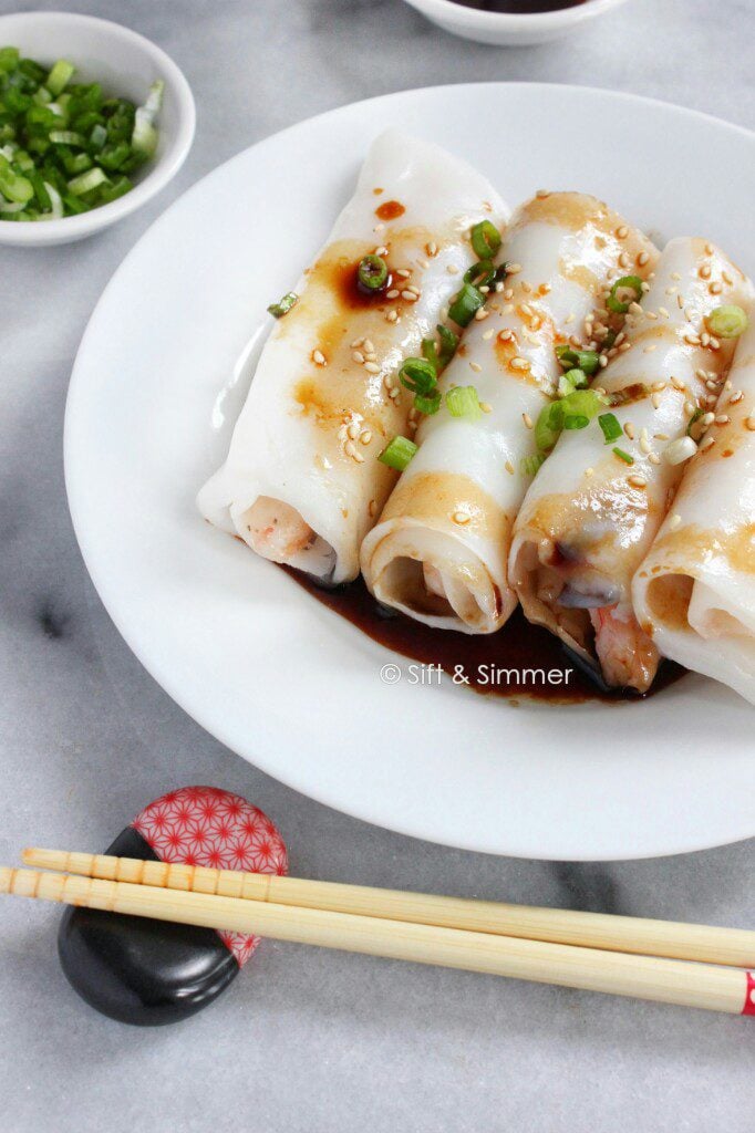 Chee Cheong Fun Rice Noodle Rolls on white plate, with chopsticks on side.