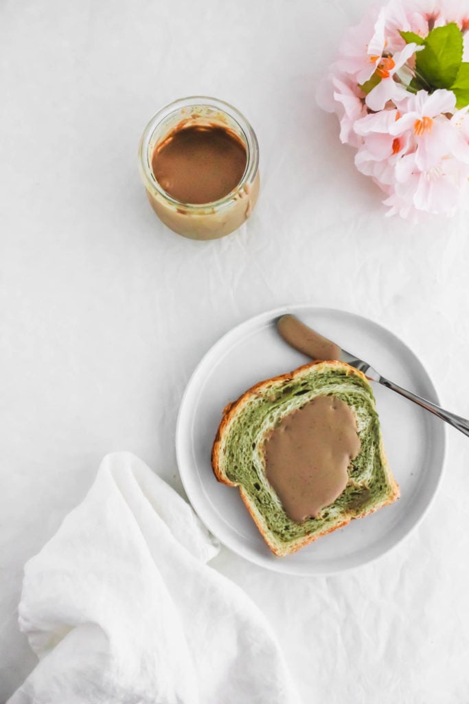 Hojicha Roasted Green Tea Milk Jam spread on matcha toast on small plate.