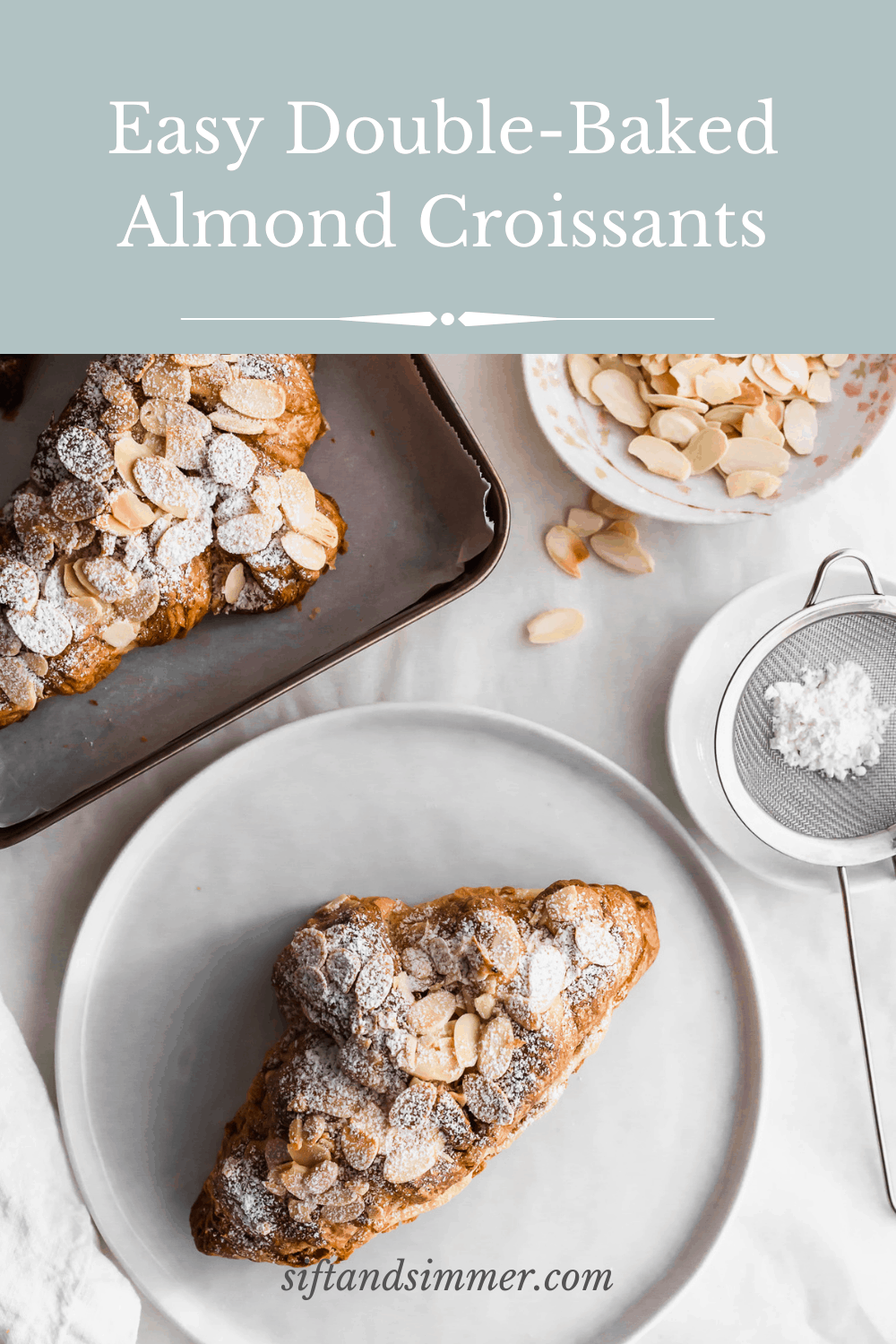 Almond croissant on a white round plate with tray of almond croissants on a tray, flaked almonds scattered around with text overlay.