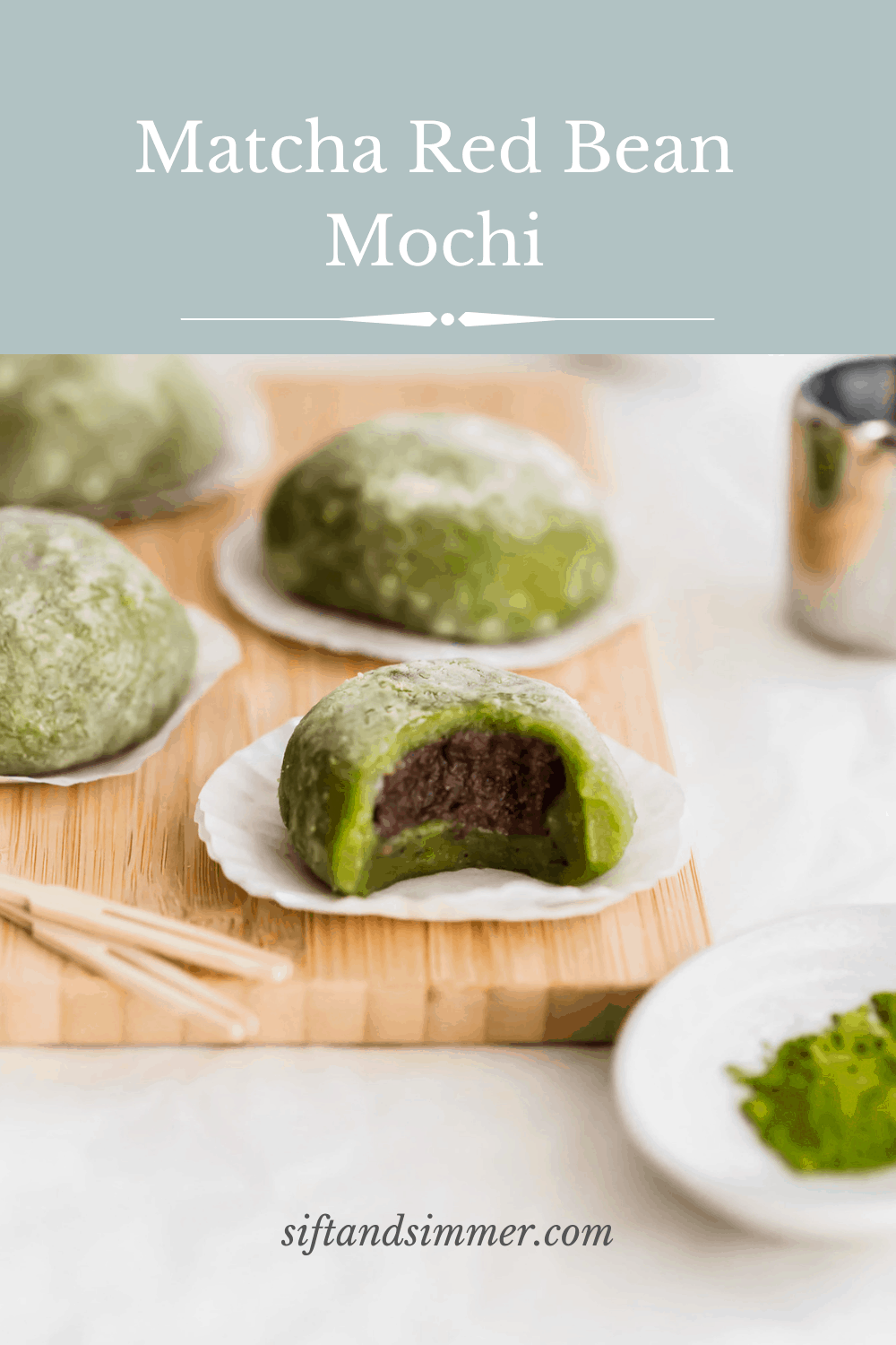 Bitten matcha mochi on cupcake liners on wooden board, revealing red bean paste inside, toothpicks and matcha powder in foreground, more mochi in the background with text overlay..