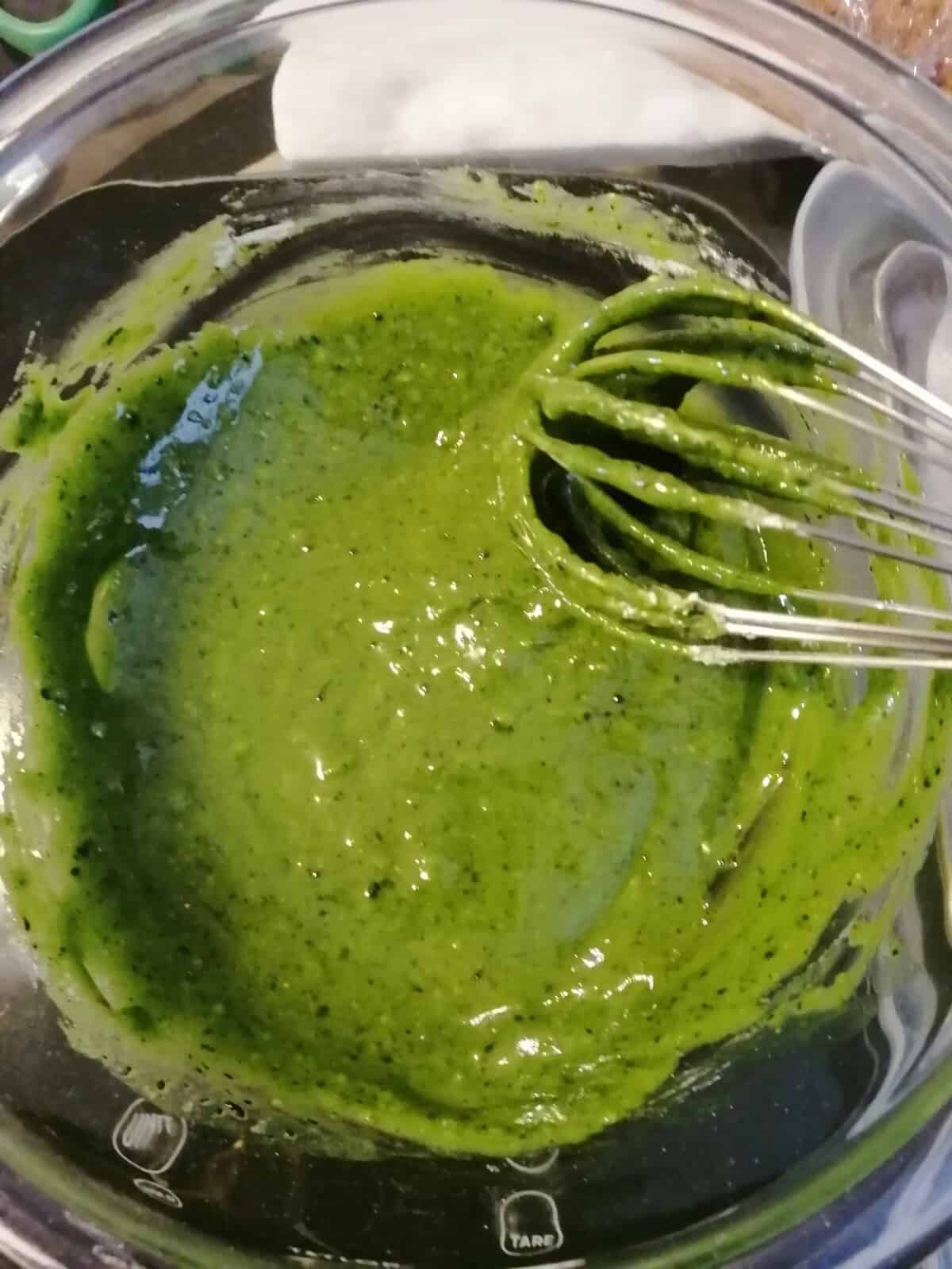Matcha egg yolk batter with whisk.