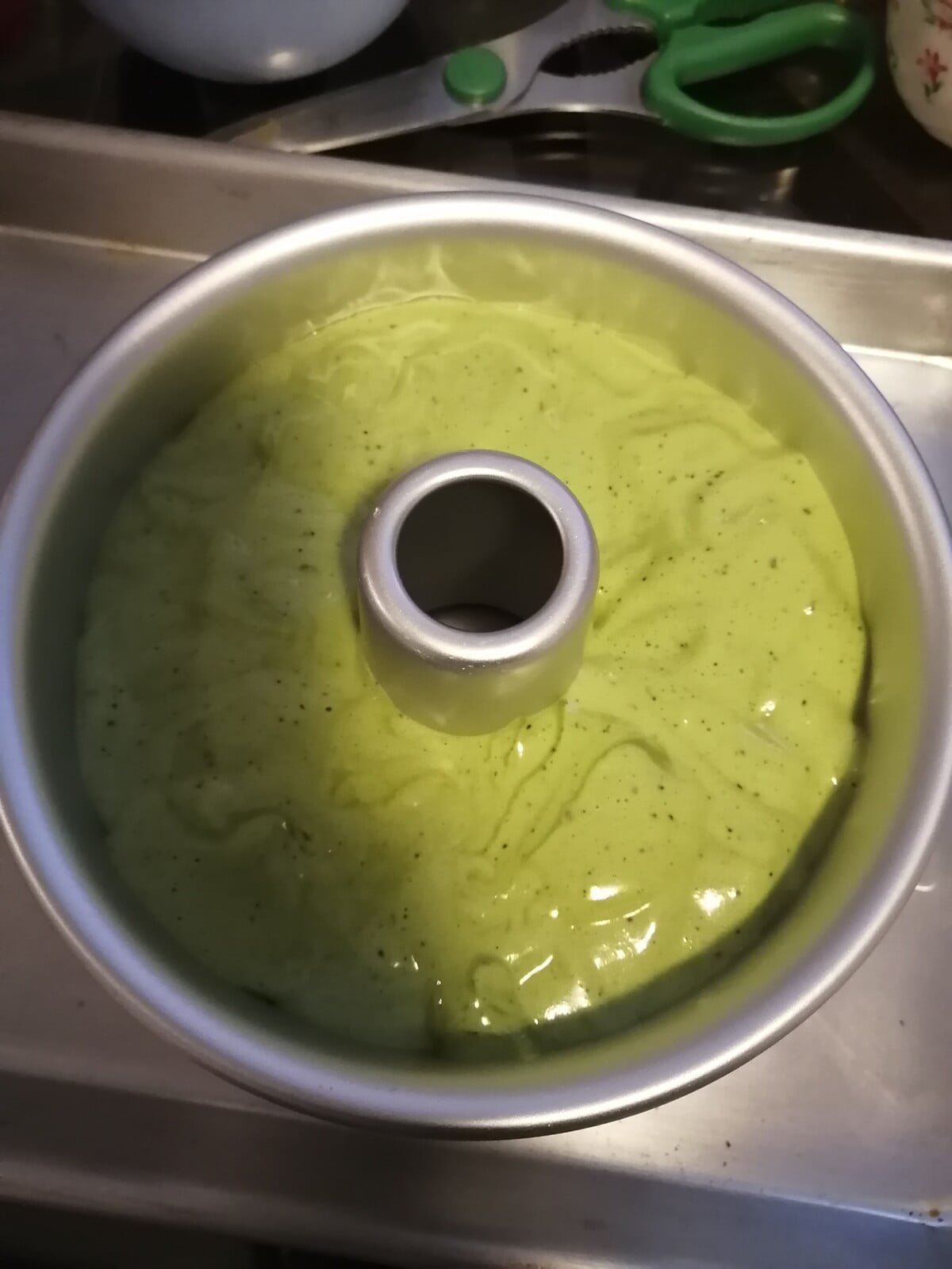 Matcha chiffon cake batter in tube pan.