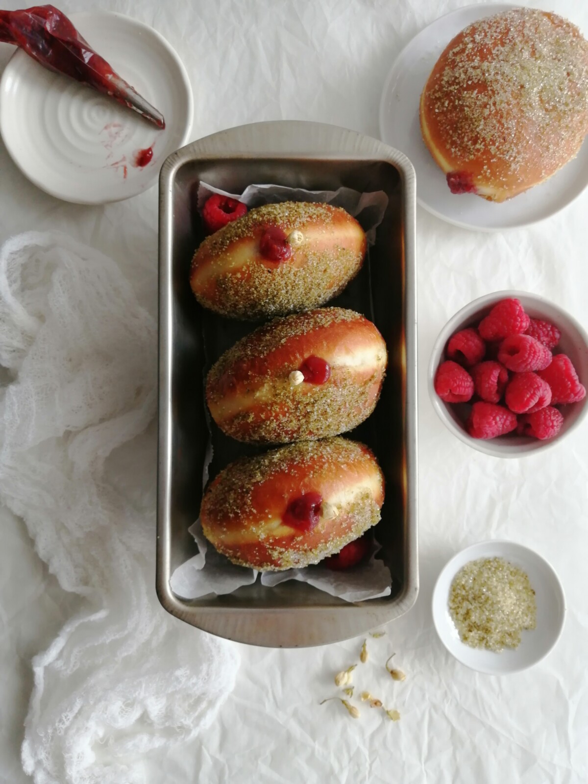 Jasmine Sugar Raspberry jam filled donuts in loaf pan.