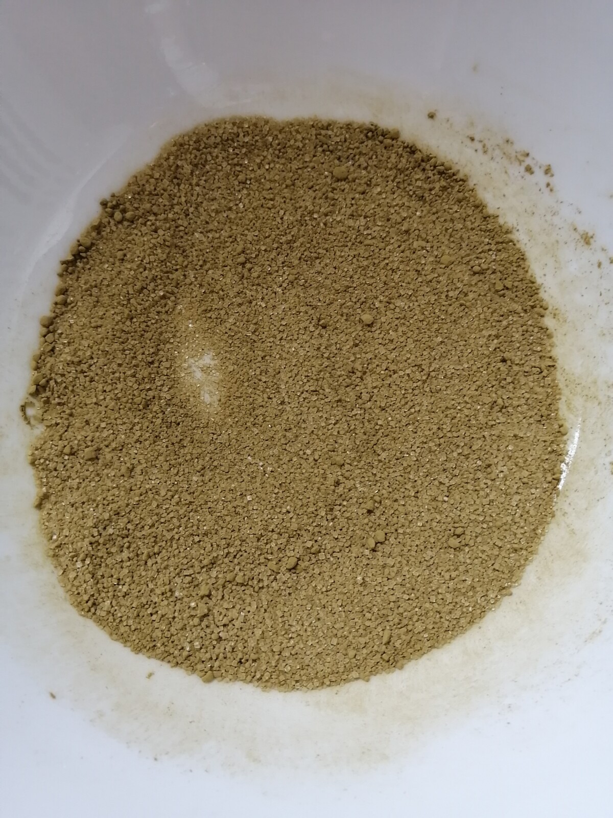 Jasmine sugar mixed in a white bowl.