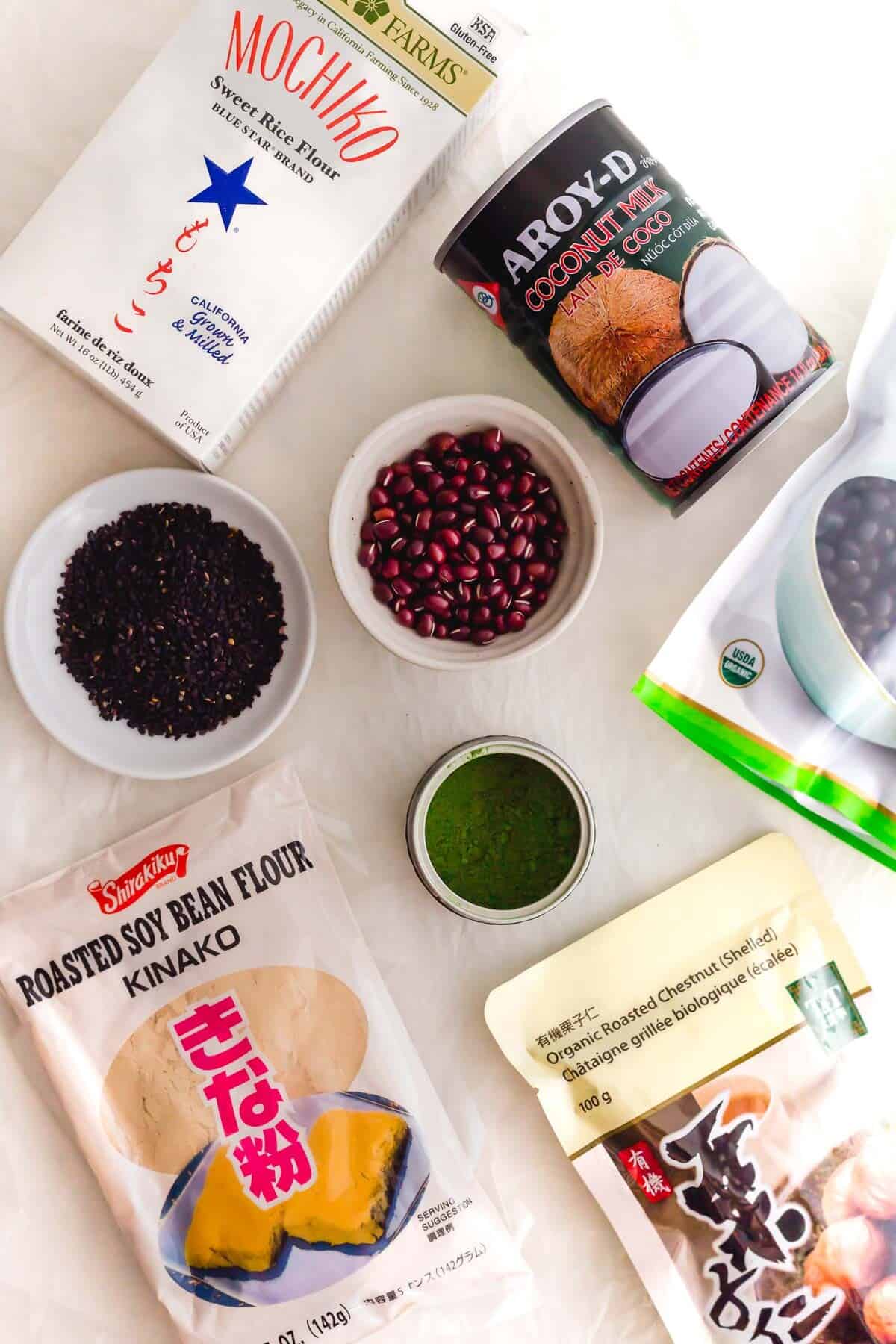 Various Asian pantry ingredients, some in dishes, some in packaging.