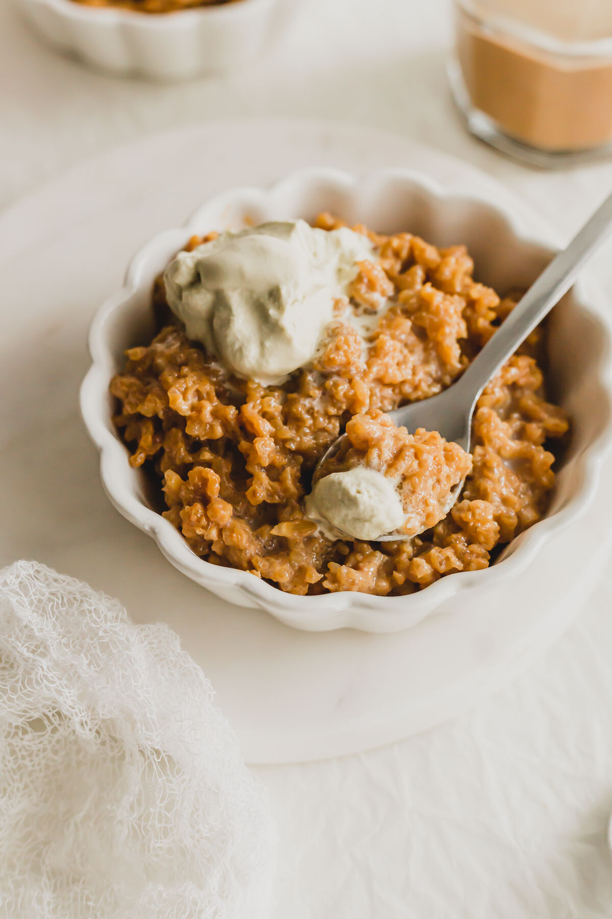 Close up of a scoop of Hong Kong milk tea rice pudding  in a white ramekin.