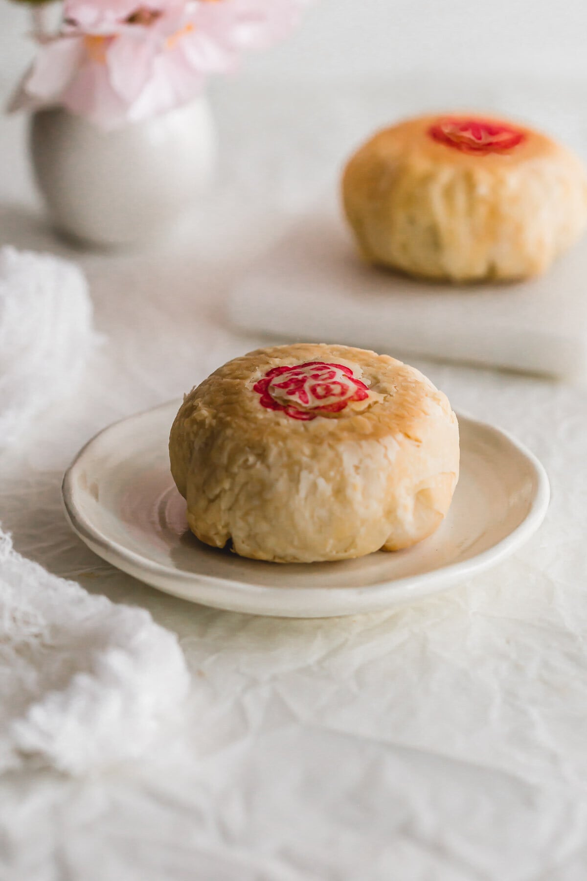 Suzhou mooncake on a white dish.