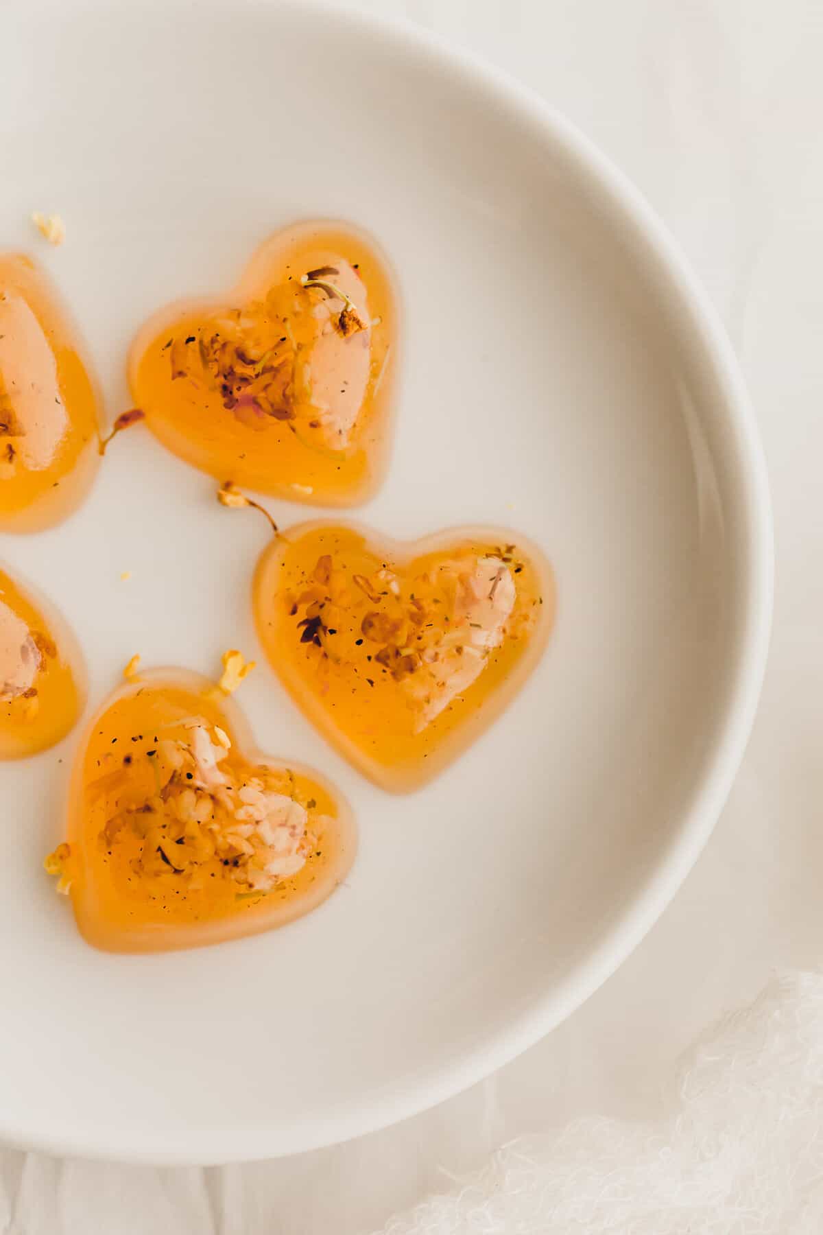 Osmanthus jellies on a white dish.