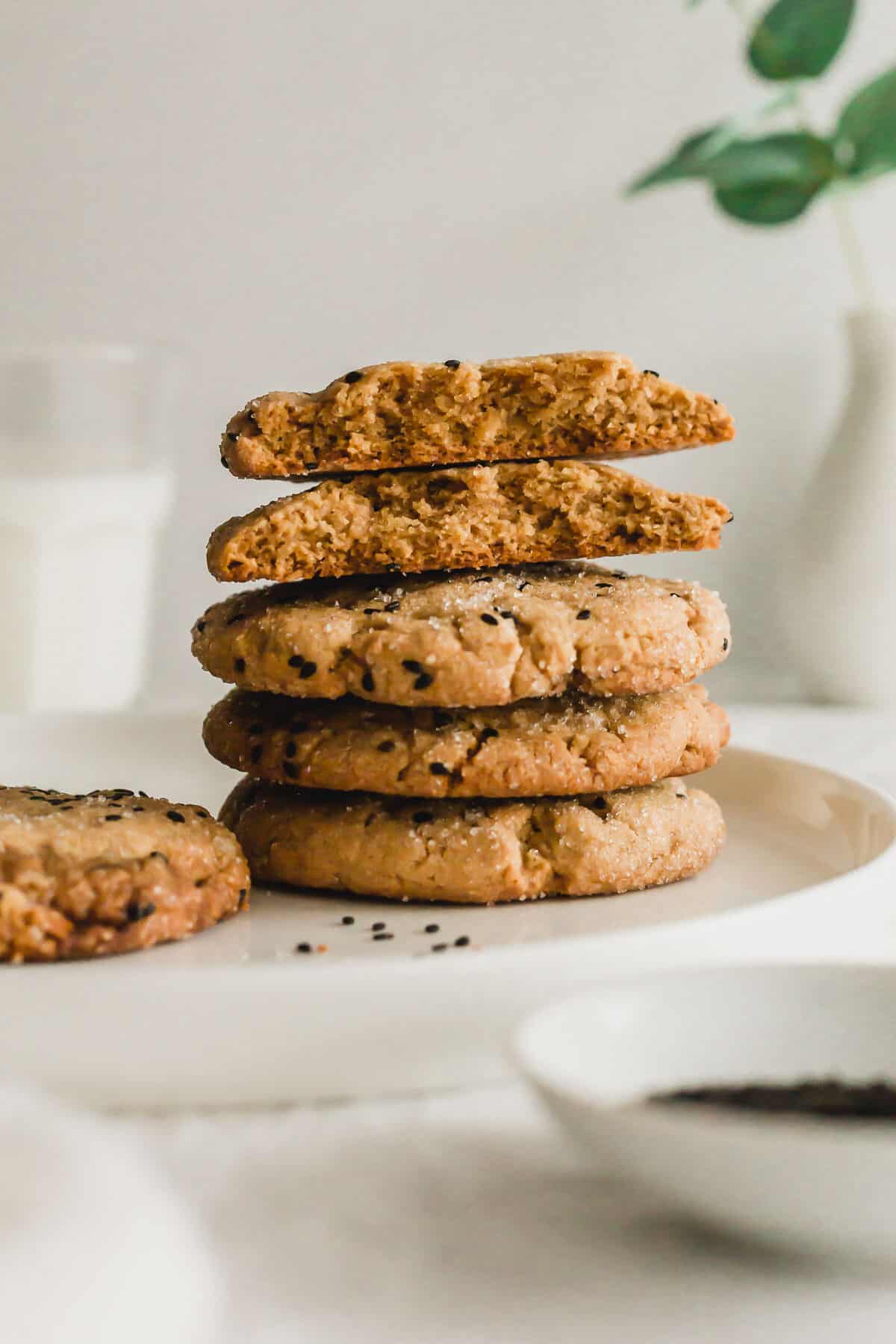 Stack of tahini miso cookies on white plate.