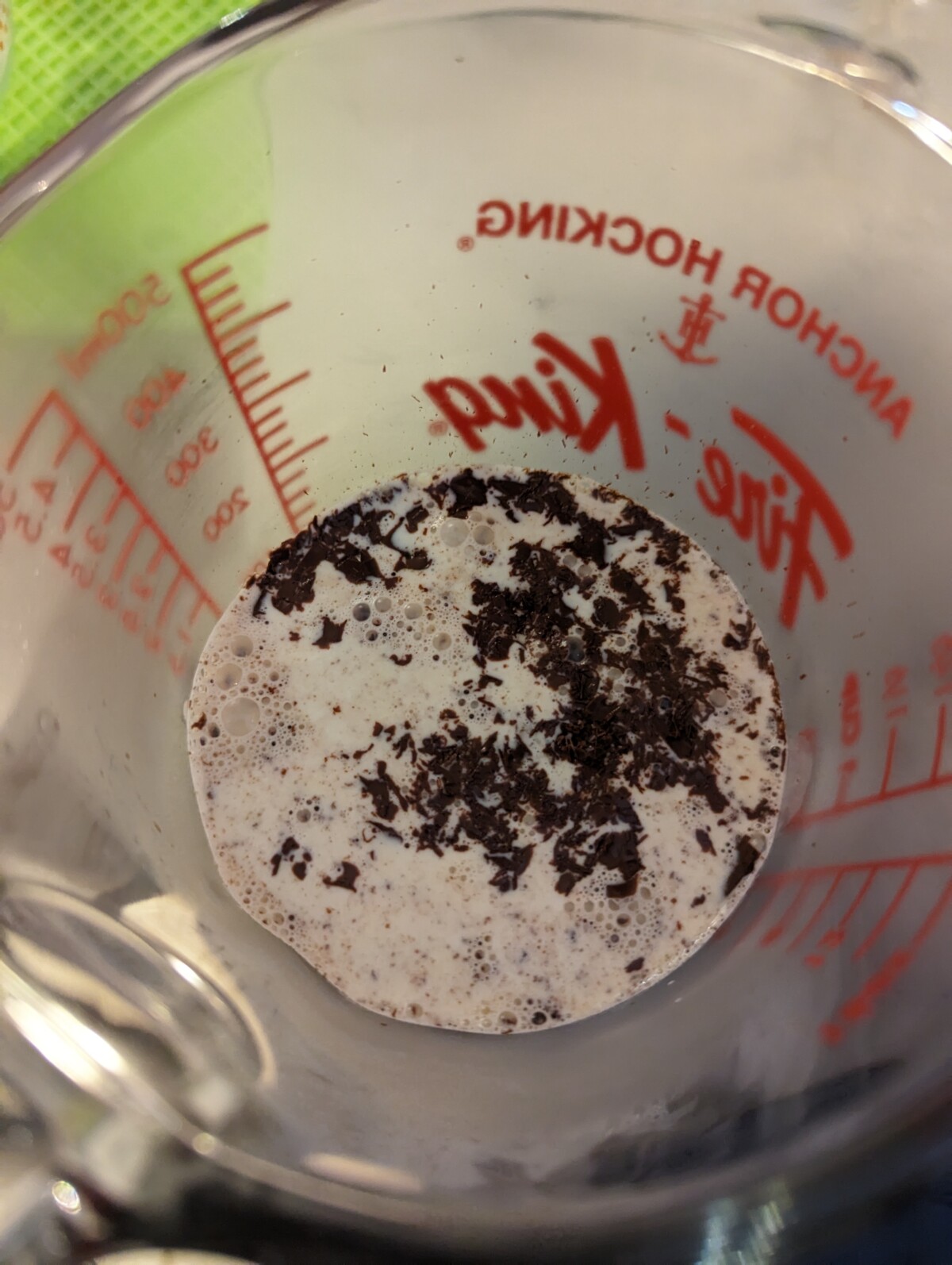 Warmed heavy cream poured into the shaved chocolate.