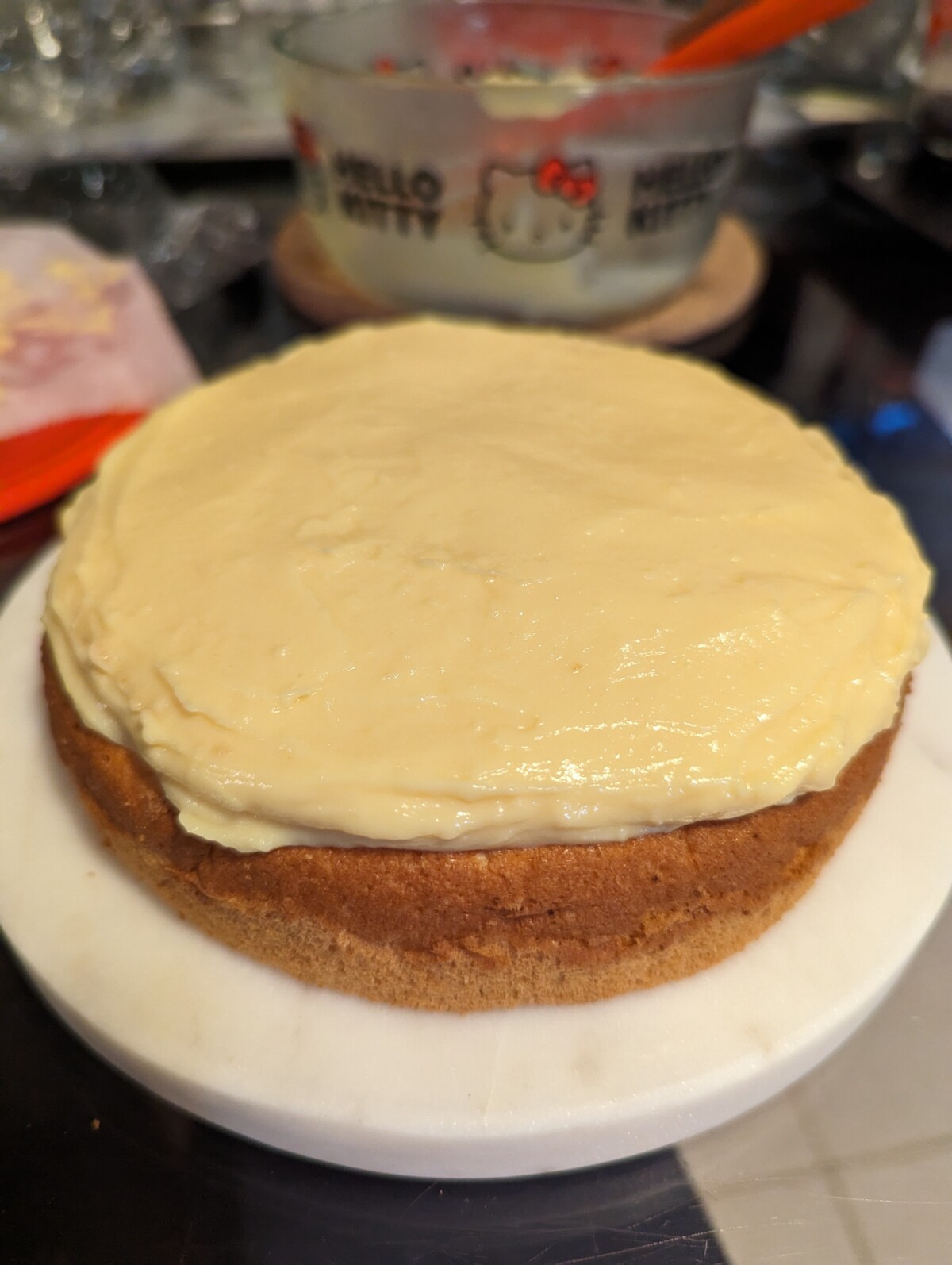 Cake topped with a layer of pastry cream.