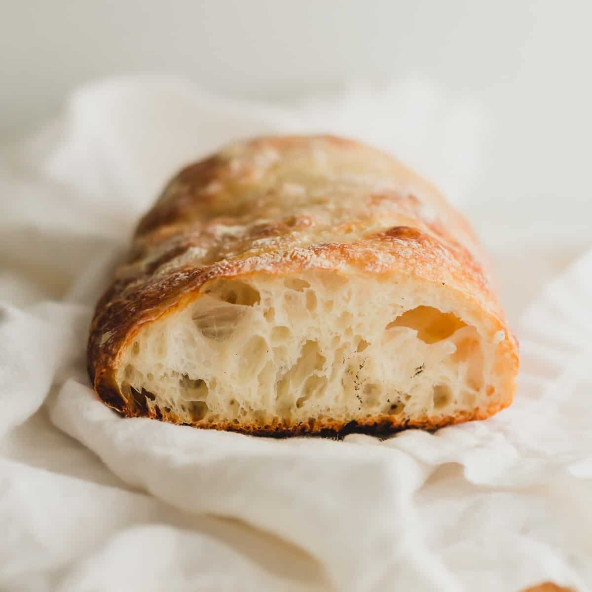 Sliced open baguette revealing interior.