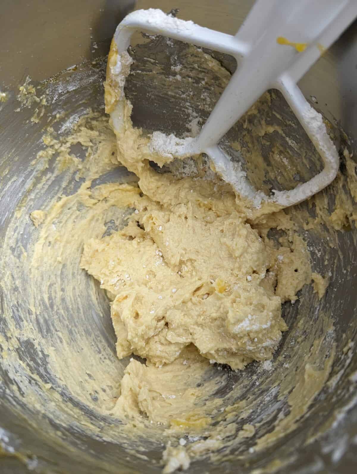 Lightened creamed butter in stand mixer bowl with flat beater attachment.