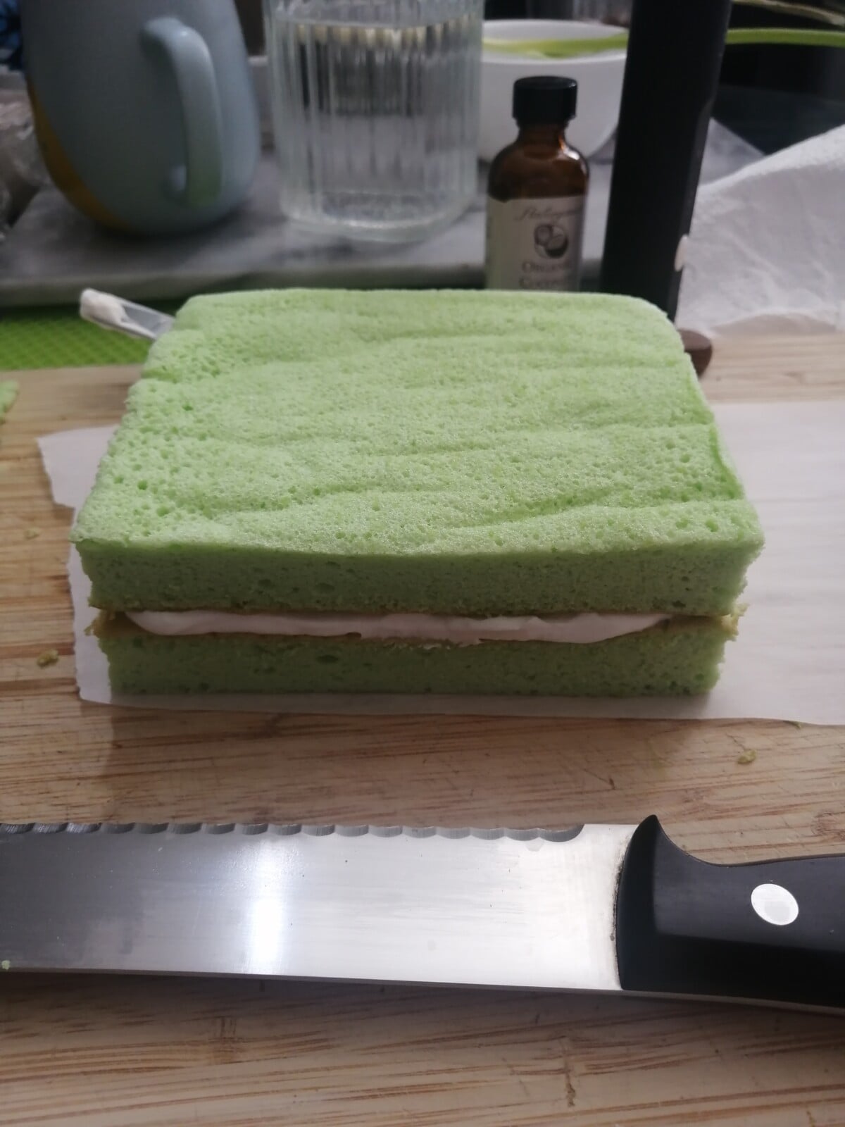 Pandan coconut cream cake ready to be sliced.