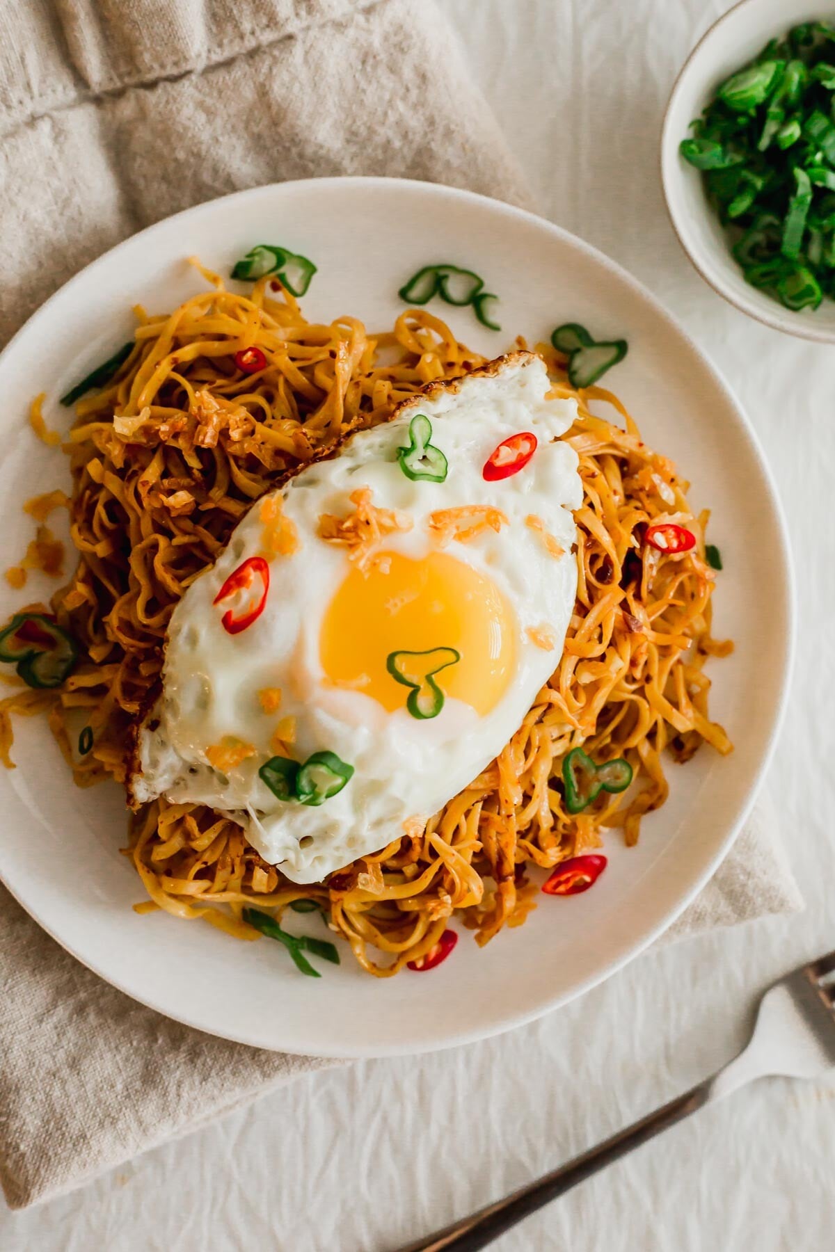 Mee goreng noodles on a white plate.