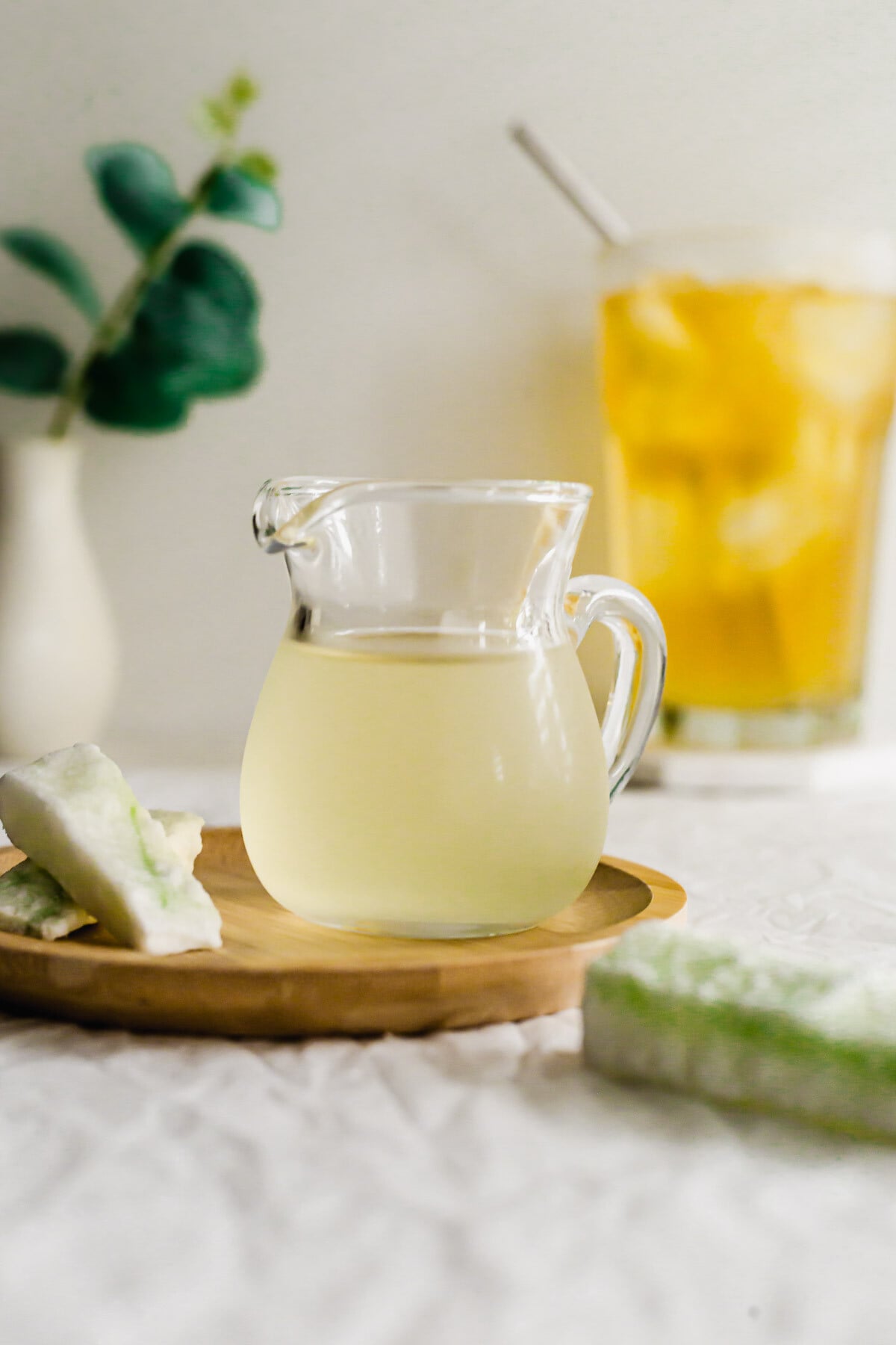 Wintermelon syrup in a glass pitcher.