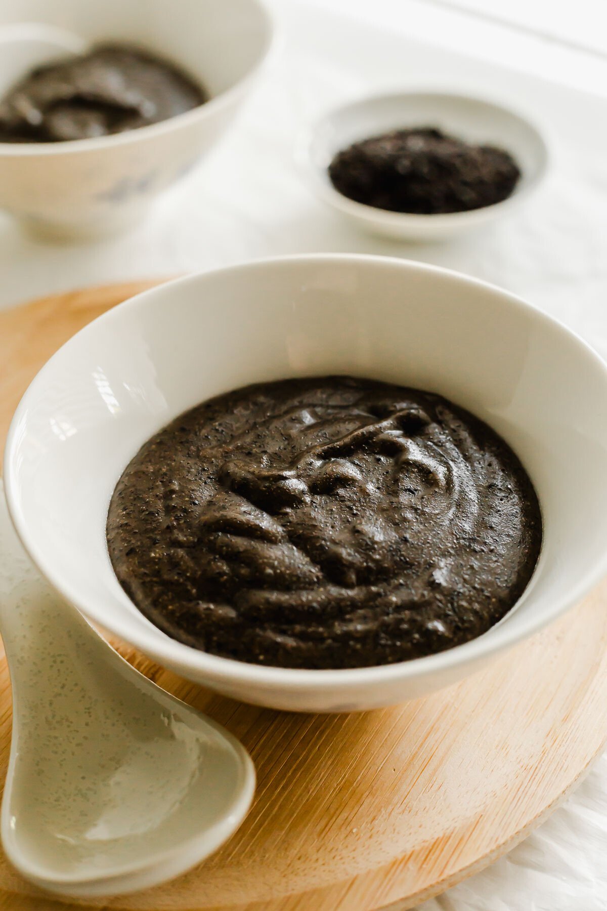 Black sesame paste in a white bowl.