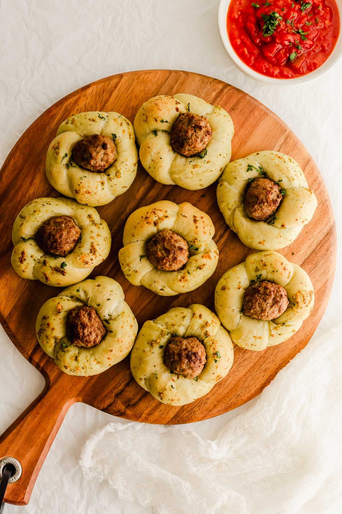 Meatball knots on a wooden board.