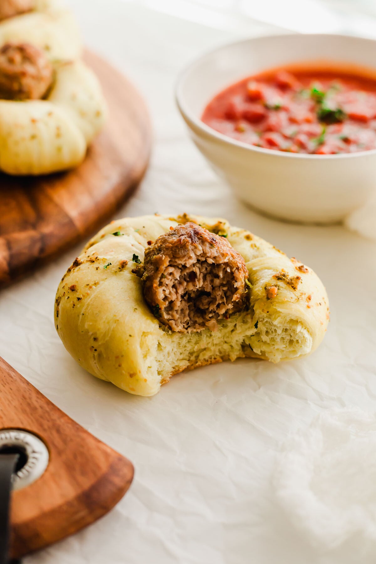 Close up of a garlic meatball knot, revealing interior.