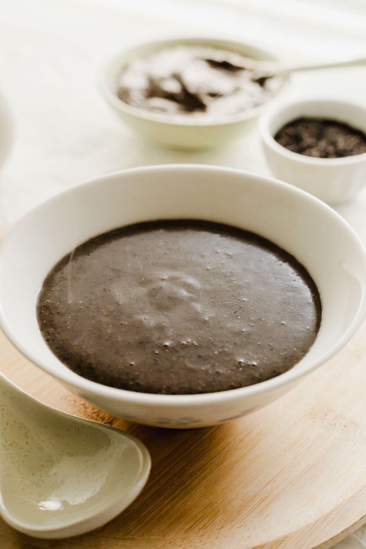 Black sesame soup in a white bowl.