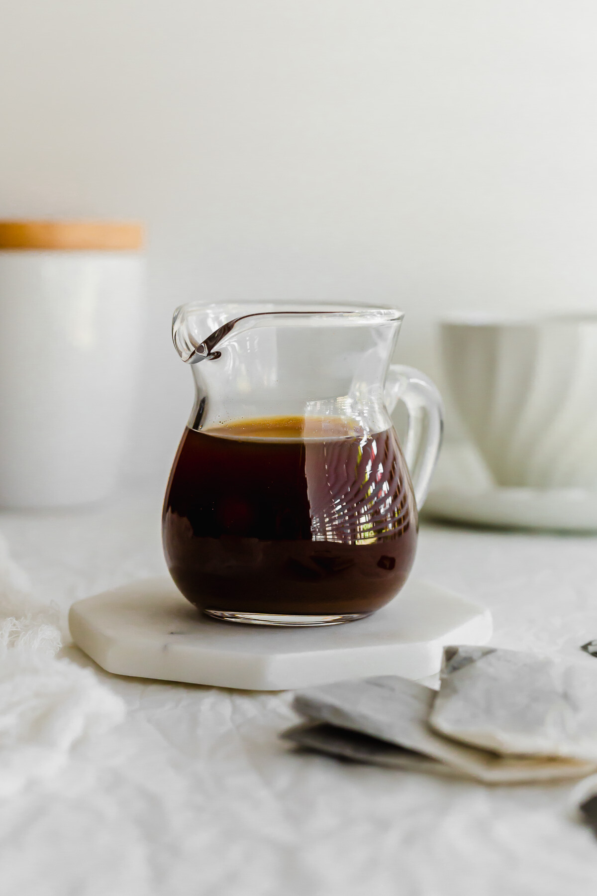 Earl grey tea syrup in a glass pitcher.