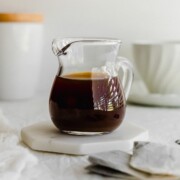 Earl grey syrup in a glass pitcher.