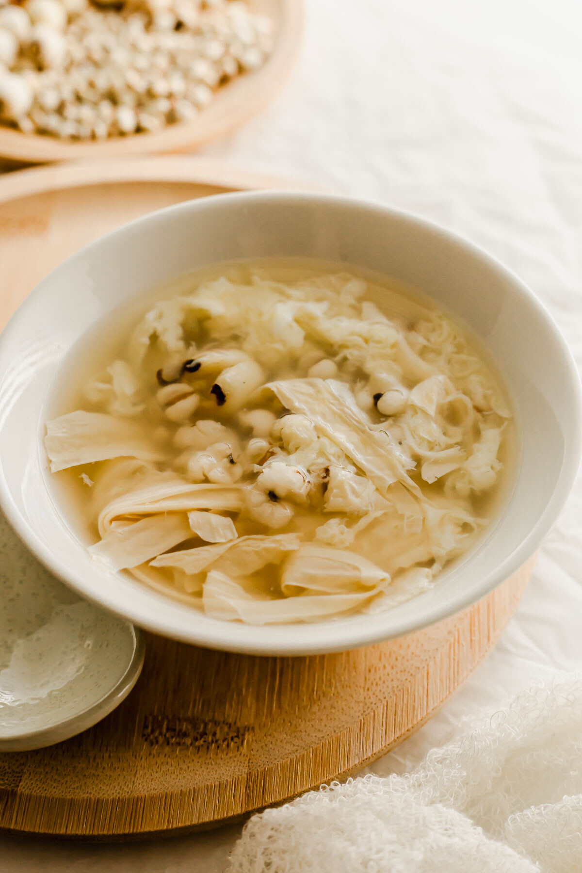 Chinese Job's tears pearl barley dessert soup in a white bowl.