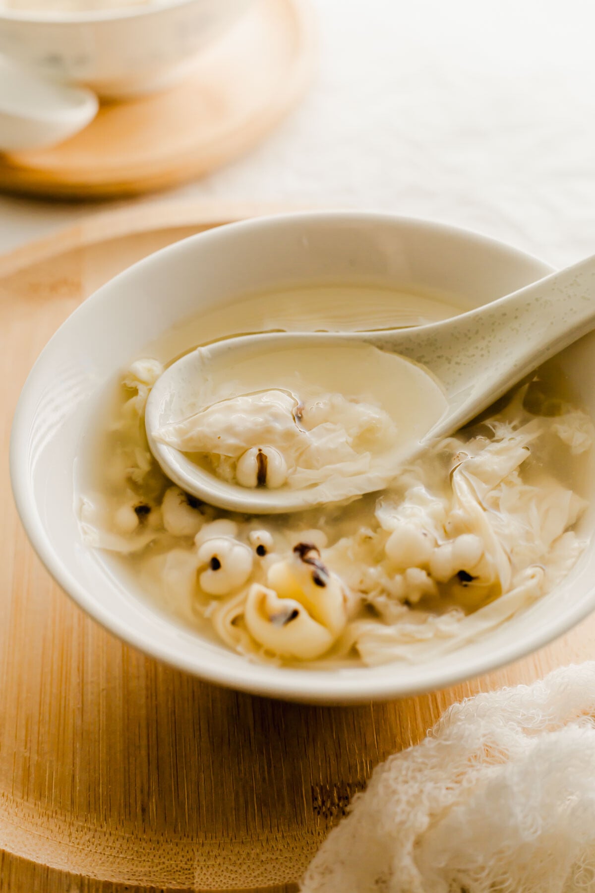 Chinese Job's tears dessert soup in a white bowl.