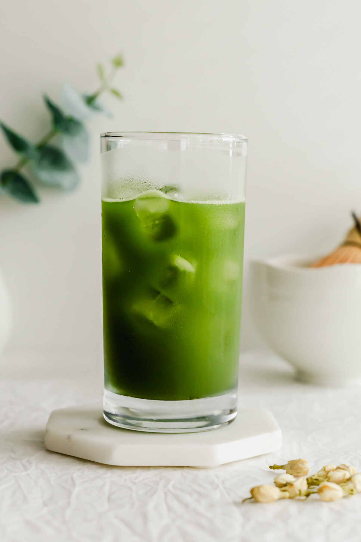 A glass of iced matcha jasmine tea.