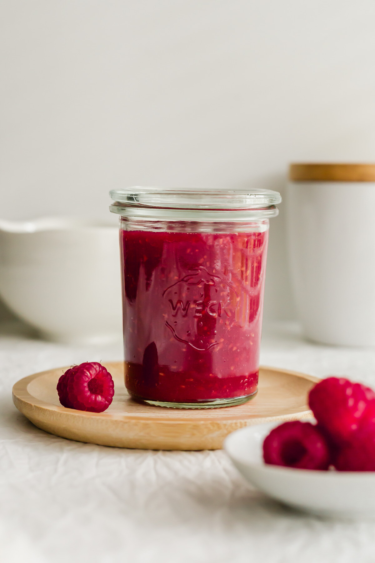 A glass filled with raspberry sauce.