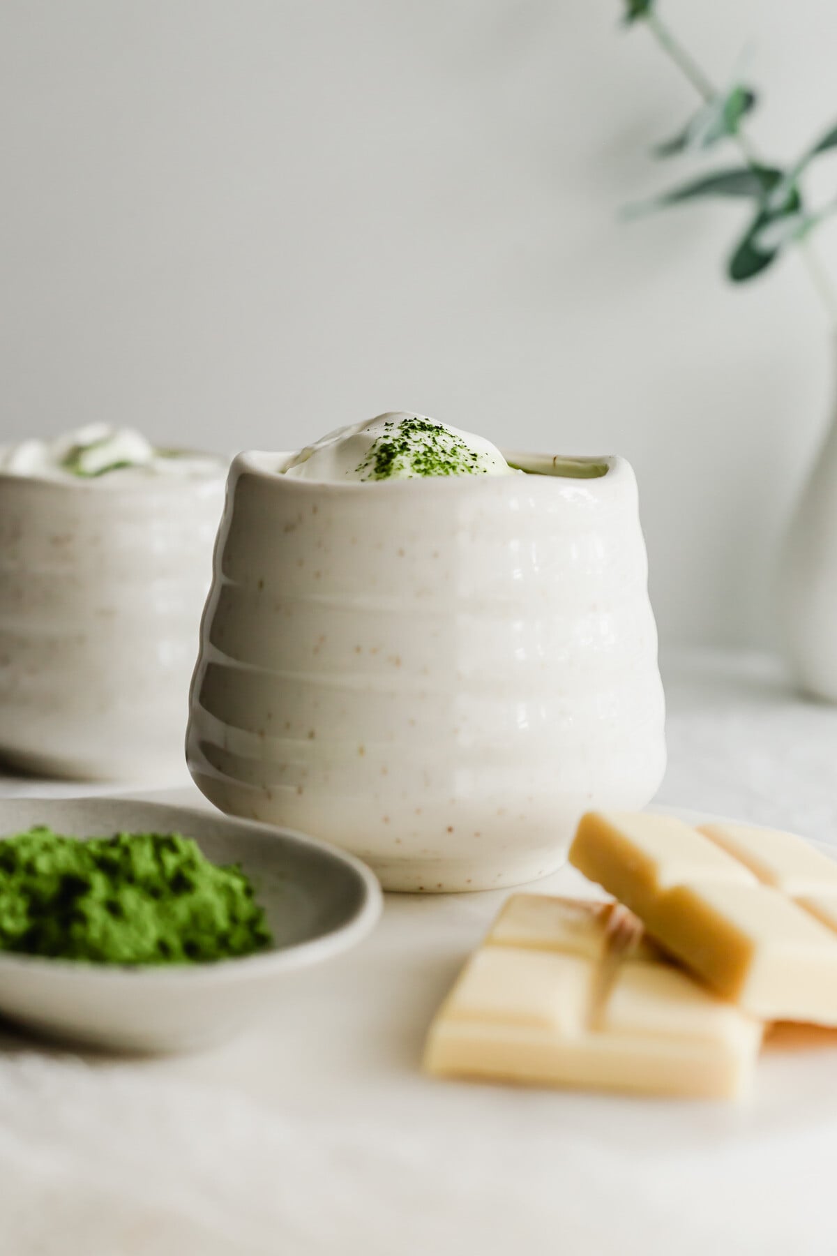 Matcha white hot chocolate in a white mug.