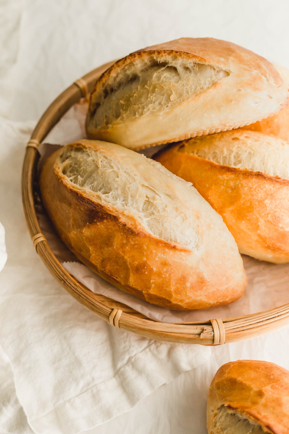 Vietnamese baguettes in a bamboo tray.