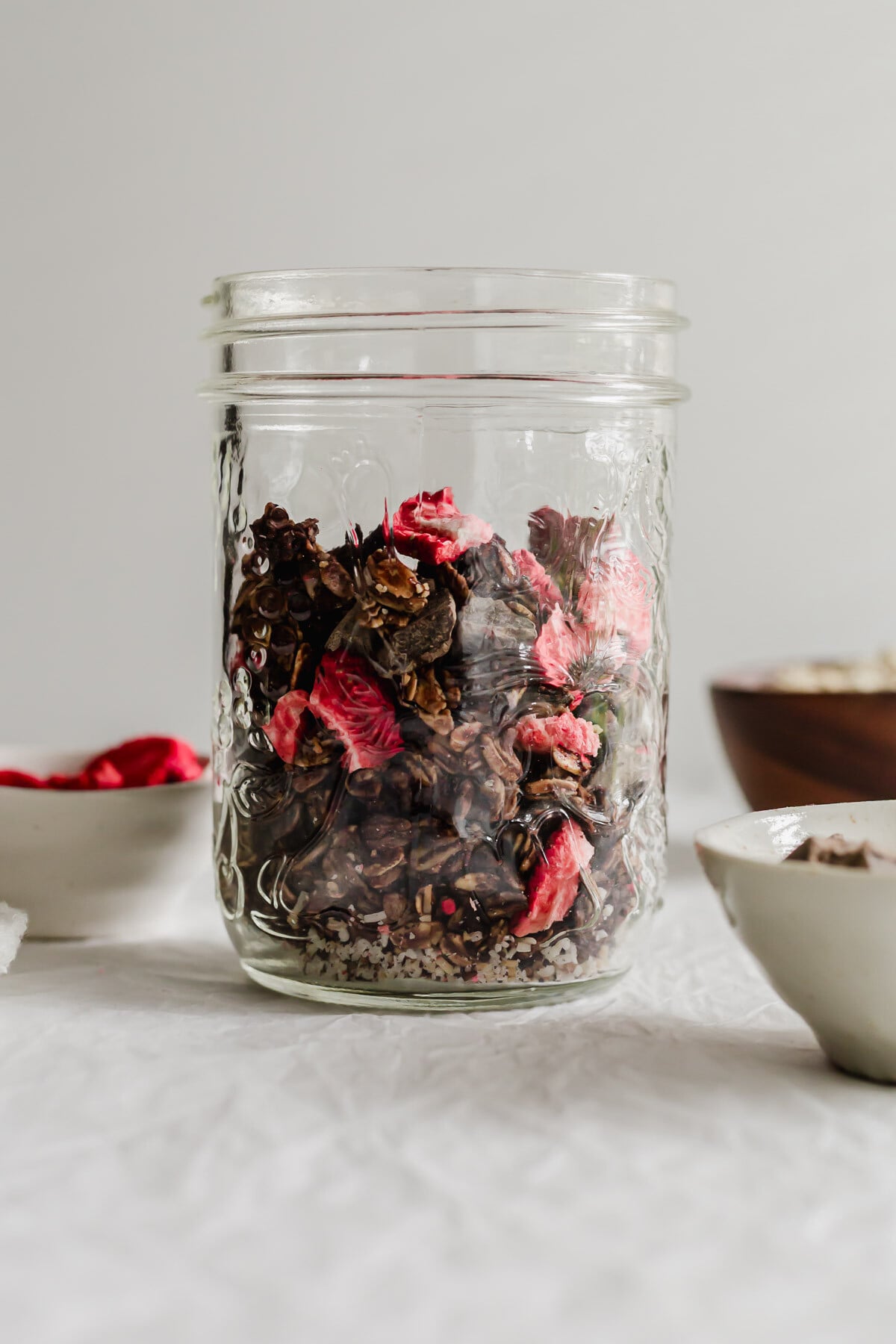 Glass jar filled with homemade love crunch granola.