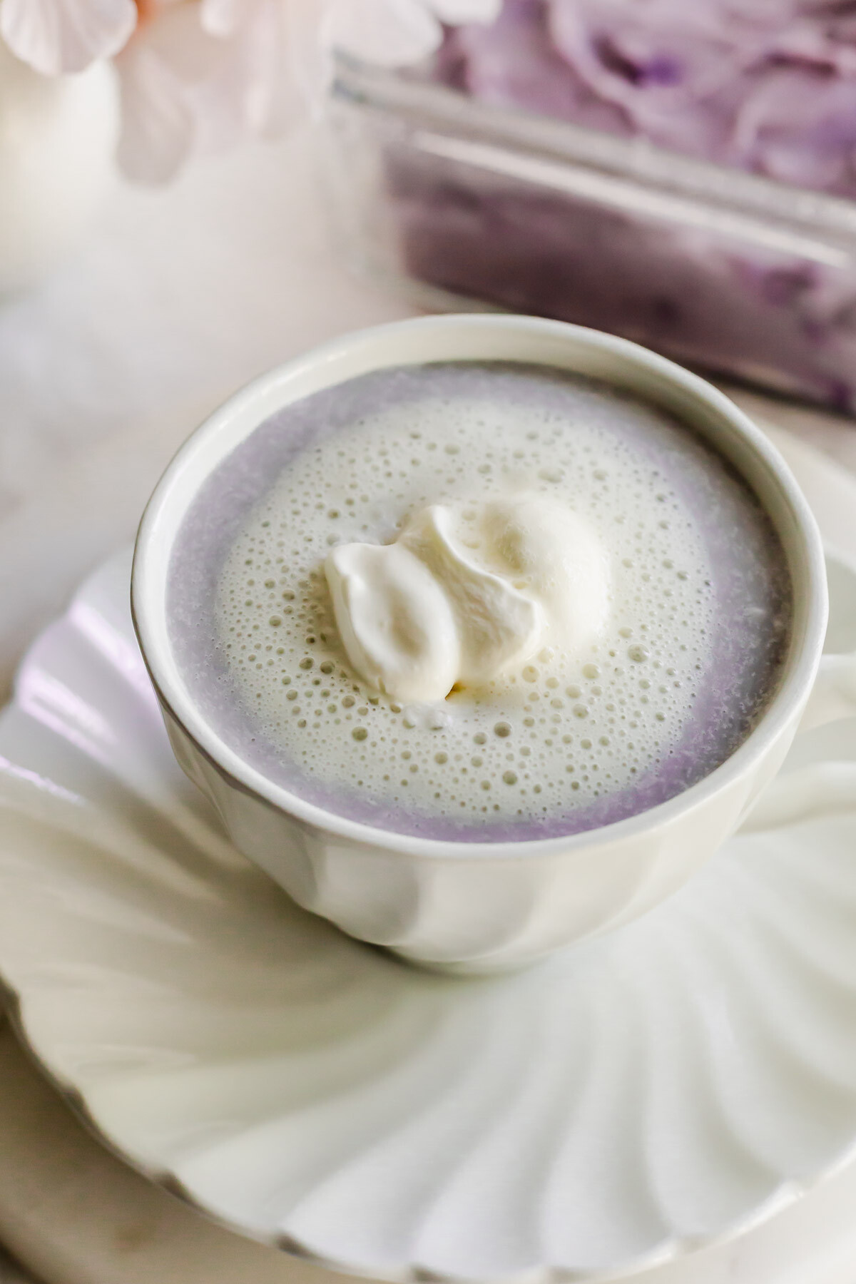 Taro latte in a white cup.