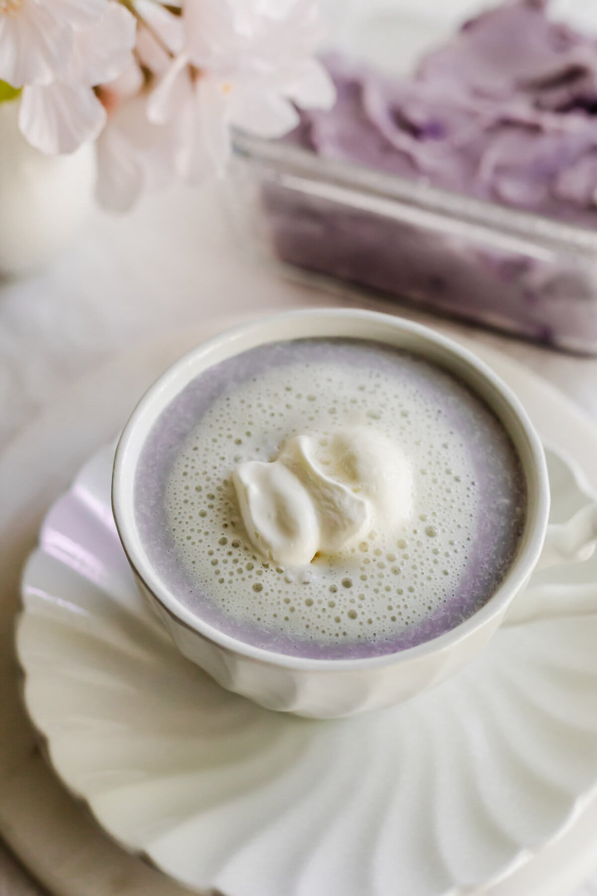 Taro latte in a white cup.
