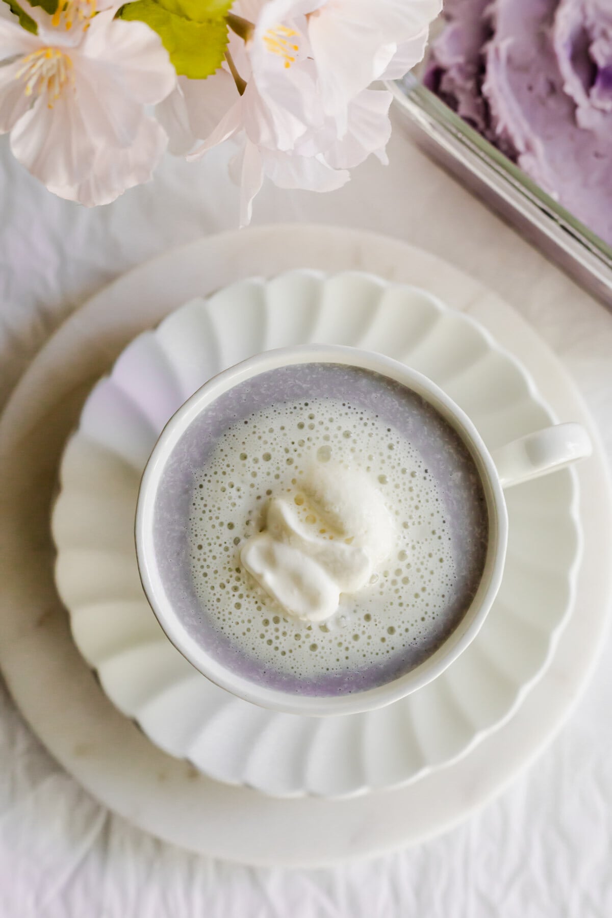 Taro latte in a white cup.